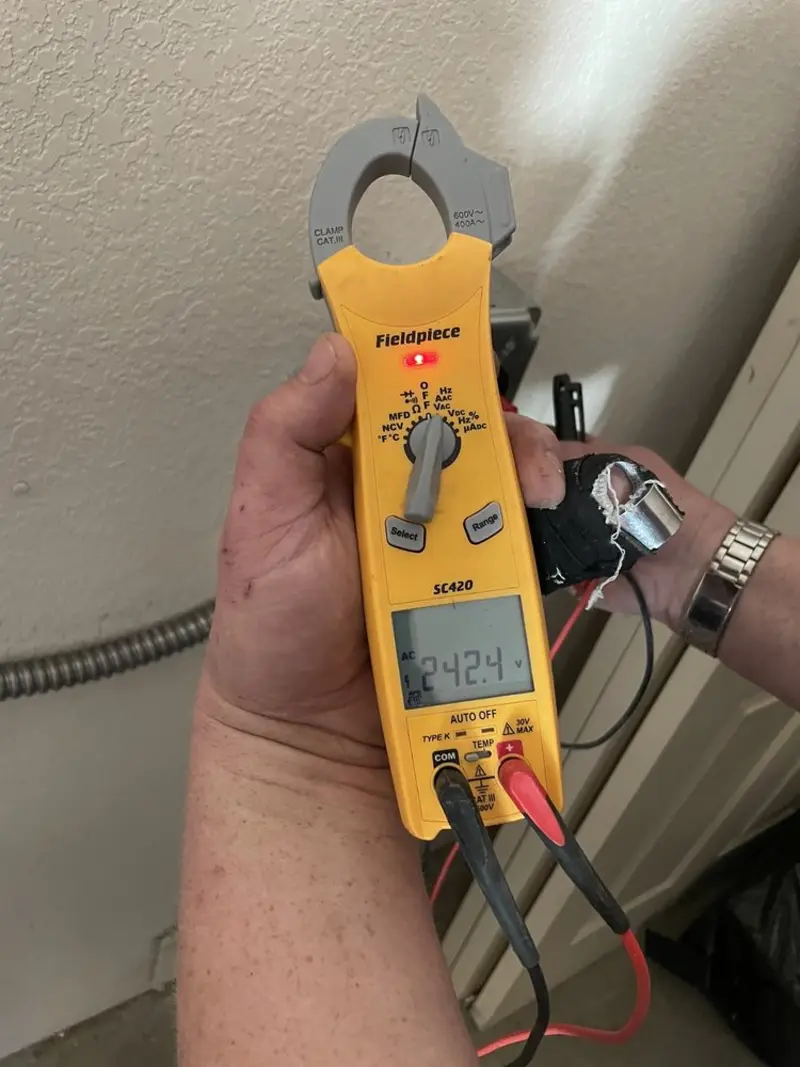 Voltage testing with clamp meter during Outlet Installation in Valle Vista